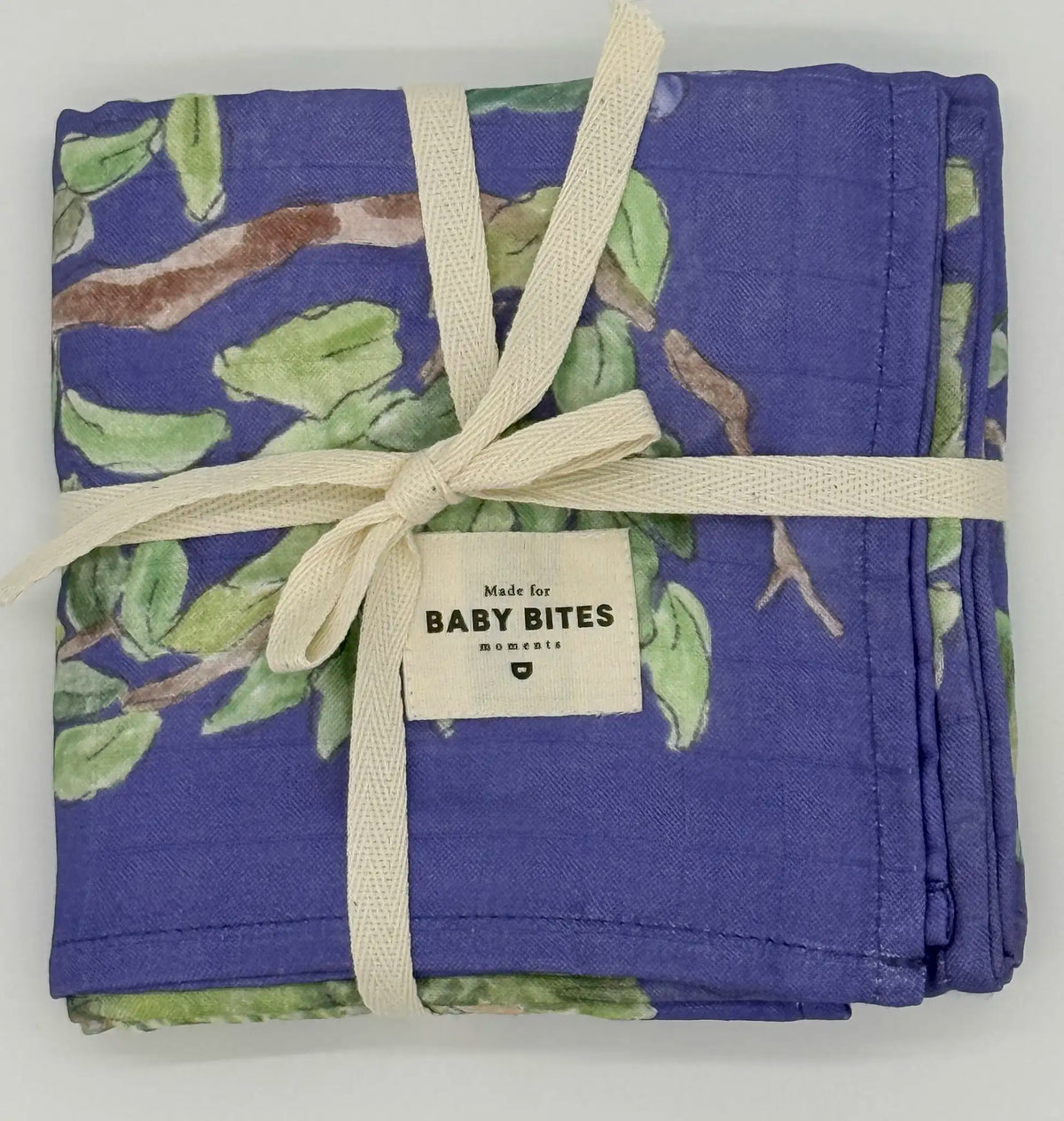 Baby Bites Blueberry Forest bamboo muslin with enchanted forest print folded
