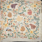 Baby Bites Honey Farm bamboo muslin swaddle blanket with bees, flowers and honeycomb illustrations print
